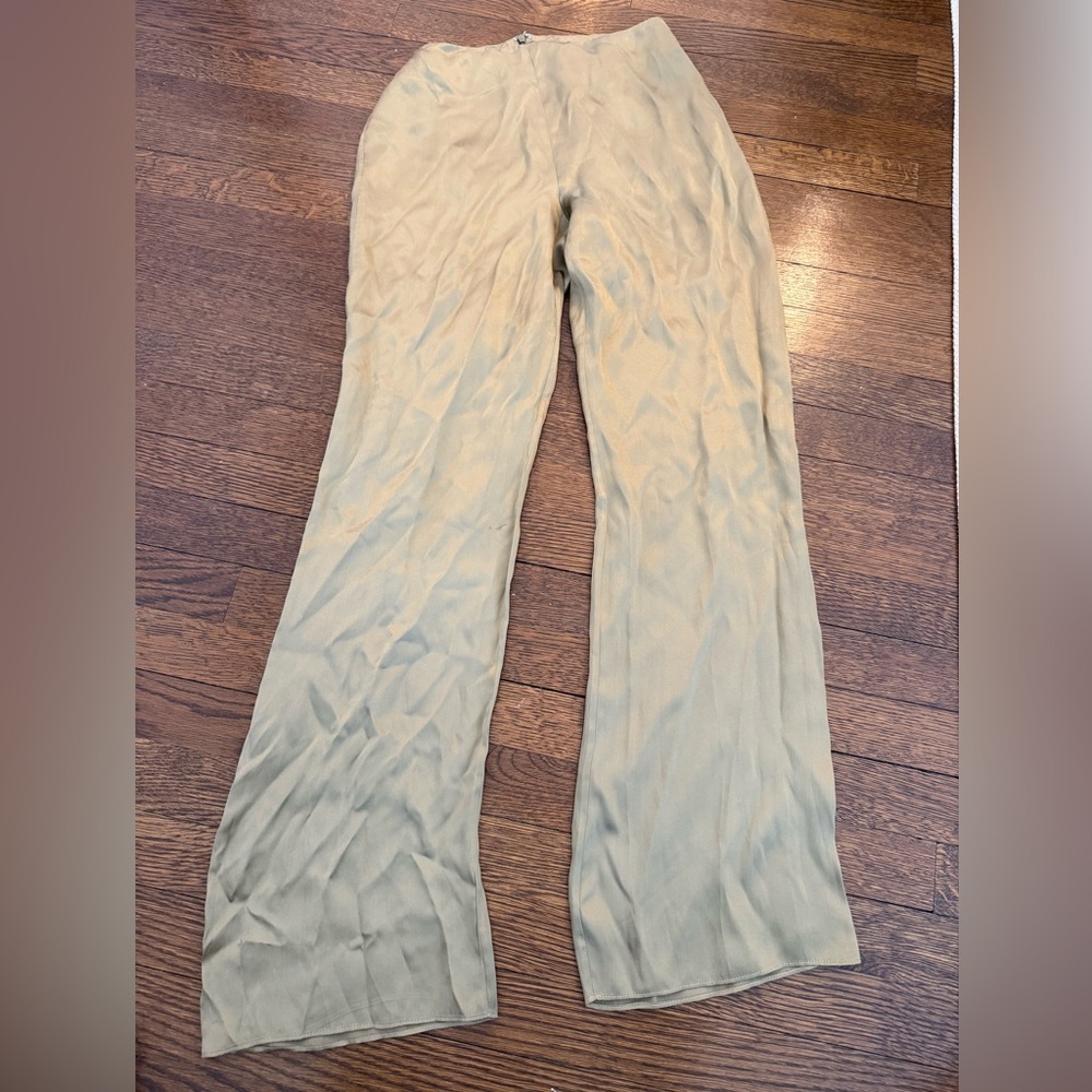 Gold silk pants.
